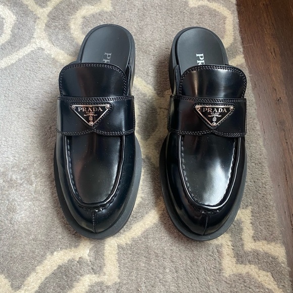 Prada Shoes - Prada Black Leather Slip-On Mules with Silver Logo